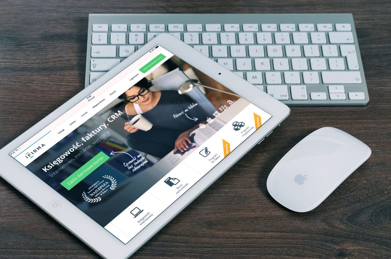 process-img A tablet with a financial website open, alongside a white keyboard and mouse. Ideal for tech-theme stock images.
