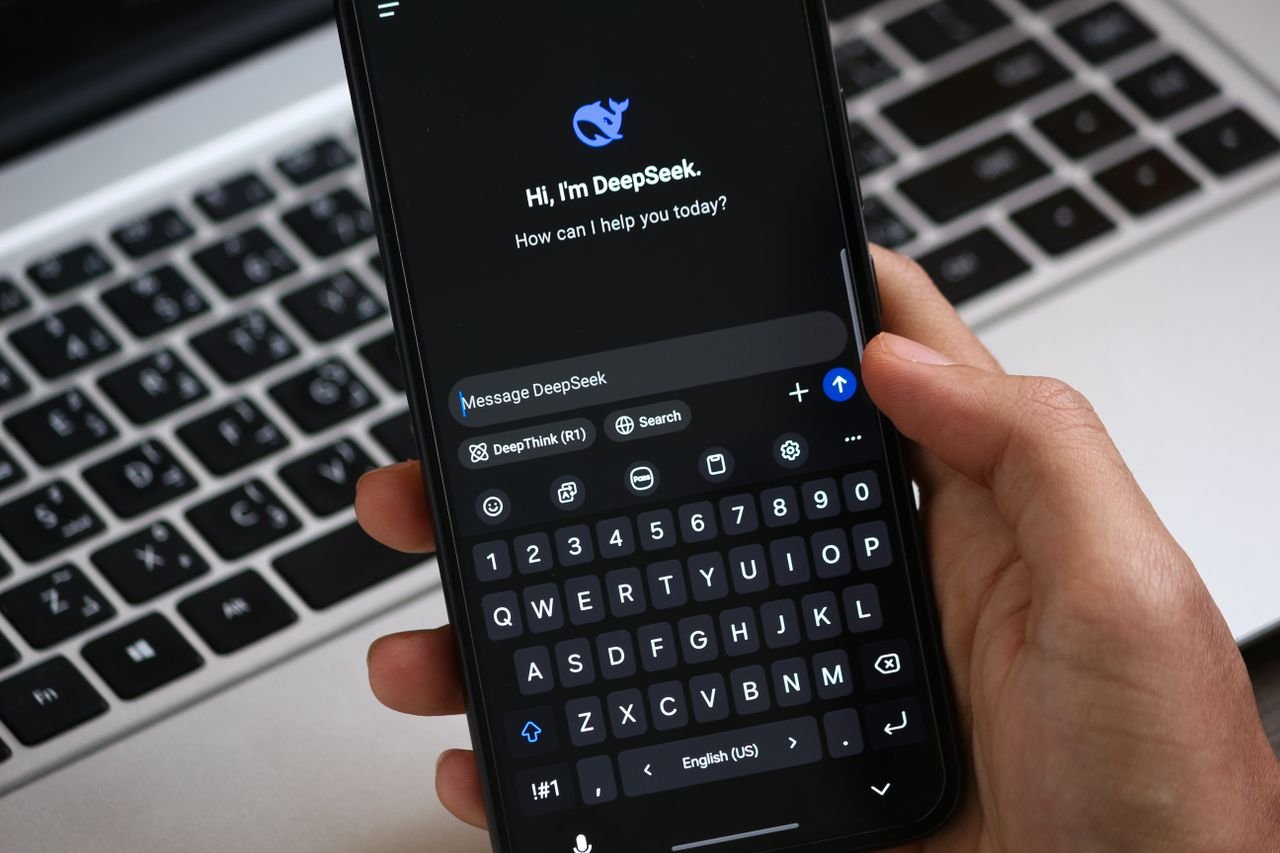 who-we-are-img Close-up of a smartphone displaying an AI chat interface, ready for interaction.